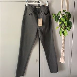 Gray high rise, raw hem skinny jeans